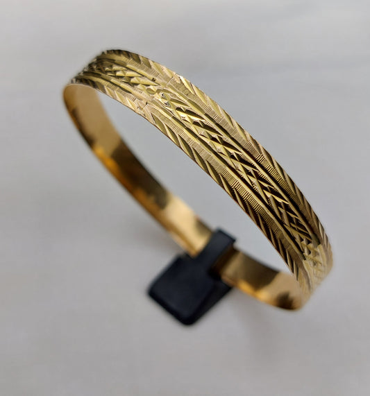 Smuk vintagearmring i 18 karat guld