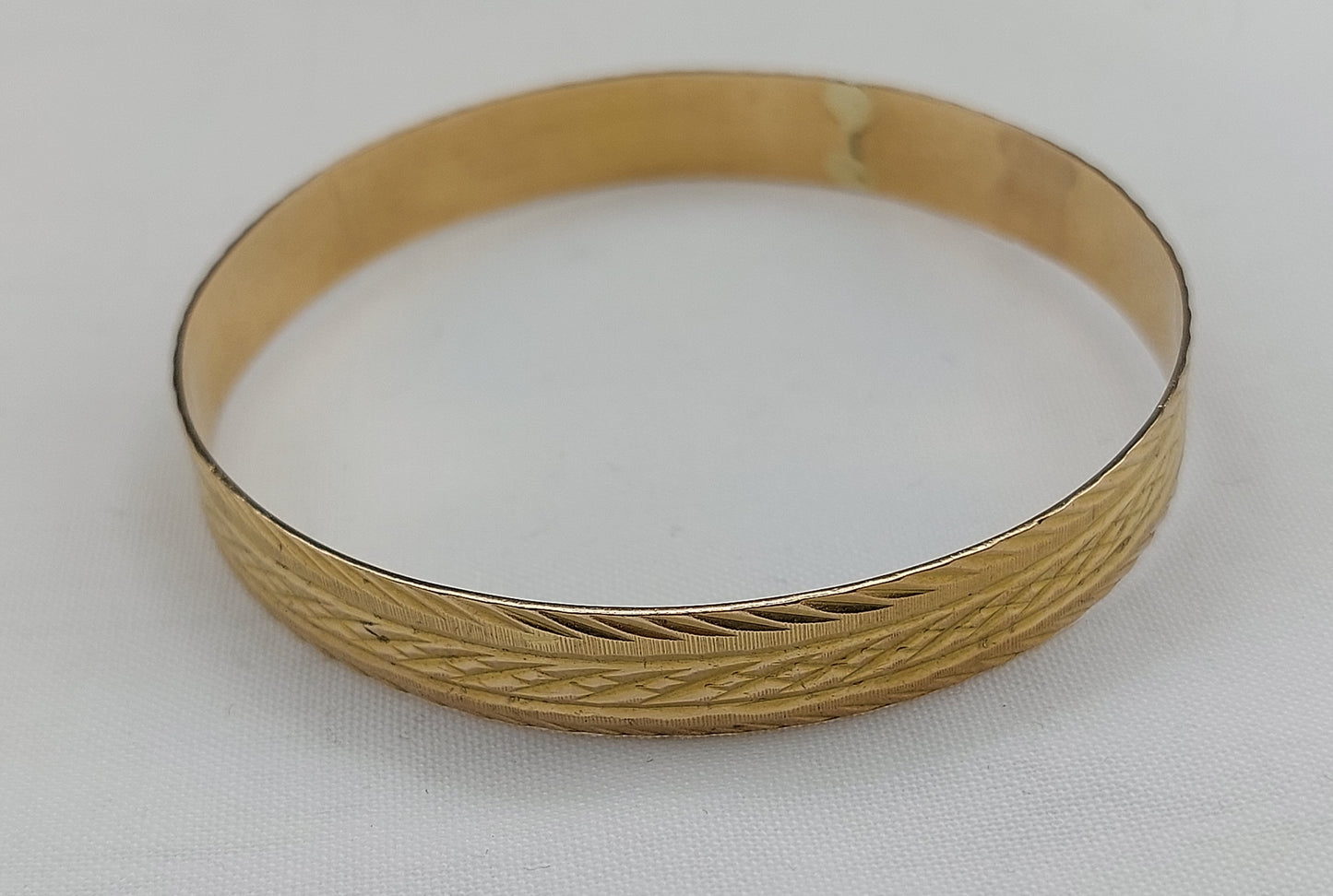 Smuk vintagearmring i 18 karat guld
